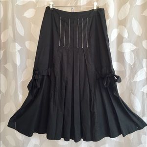 Black cotton skirt with unusual detailing.